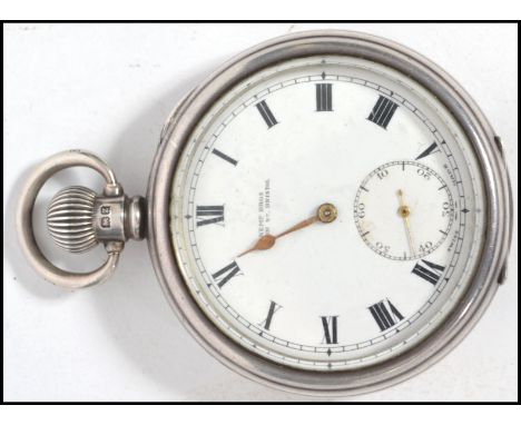 An early 20th century silver hallmarked pocket watch having crown winder and loop bale to top with roman numeral chapter ring