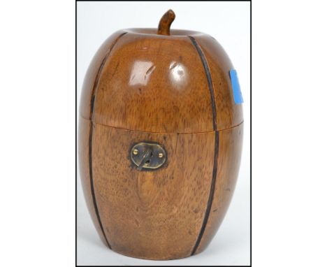 An 18th century style fruitwood tea caddy on the form of a melon with lock and key to front. Measurements: 14 cm high, 10 cm 