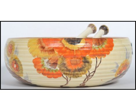 A vintage 20th century Clarice Cliff salad set decorated in the Rhodanthe pattern. The bowl having a banded design with stamp
