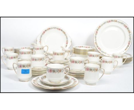 A 20th century Royal Albert dinner and tea service on the Belinda pattern consisting of coffee cans, tea cups, saucers, side 