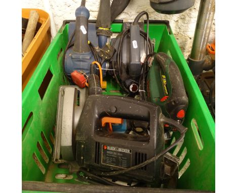 A box containing various electric hand tools, including a circular saw, a belt sander etc 