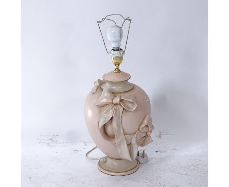 A decorative painted table lamp (no shade), with applied ribbon and bow decoration, height to top of fitting 50cm 