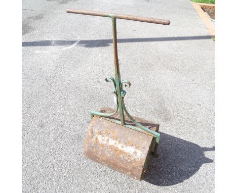 A green painted garden roller 