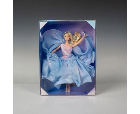 Barbie dressed in an ethereal flowing pink and blue gown adorned with sparkly sequins and stars. Part of the Essence of Natur