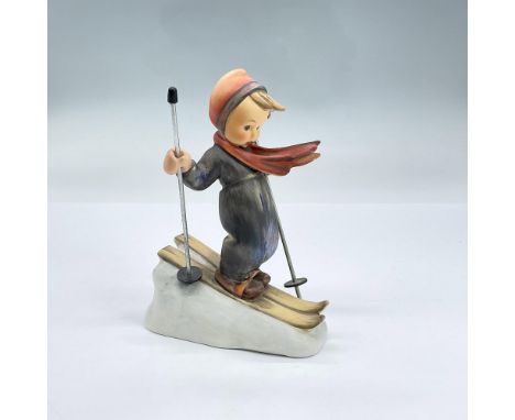Hand painted figure of a boy wearing skis and a ski suit holding ski poles. Goebel backstamp. Dimensions: 4"L x 2.5"W x 5.25"