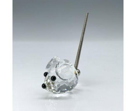 This mouse, a clear crystal figure with black crystal eyes and nose, complemented by a metal spring coil tail, was also an or
