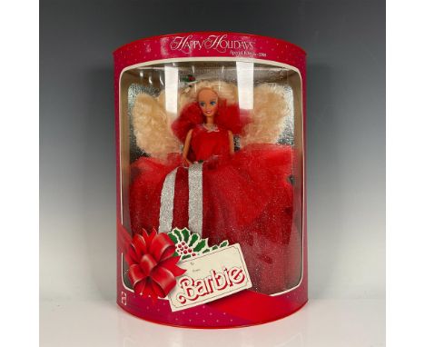 New in box festive Barbie doll in her stunning red holiday dress. Model #1703. This item has its original box. SKU: 074299017