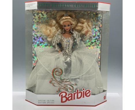 Dressed in a silver-colored gown with glittery ruffles, iridescent plastic beads and holographic sequins with matching jewelr