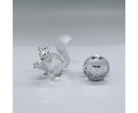 Adorable, limited edition crystal figure with frosted crystal bushy tail holding his crystal chaton, looking out with jet cry