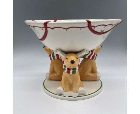 This serving bowl features three adorable reindeers dressed in their holiday clothes. The bowl and base are all one piece and