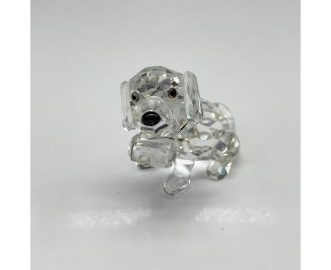 Figural created with clear crystal body with tawny crystal eyes, black nose, and elastic collar holding a keg. Swarovski back