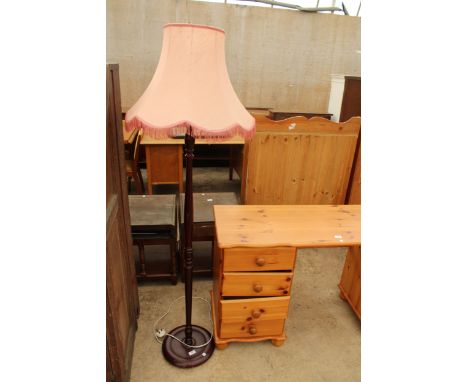 A STANDARD LAMP WITH SHADE 