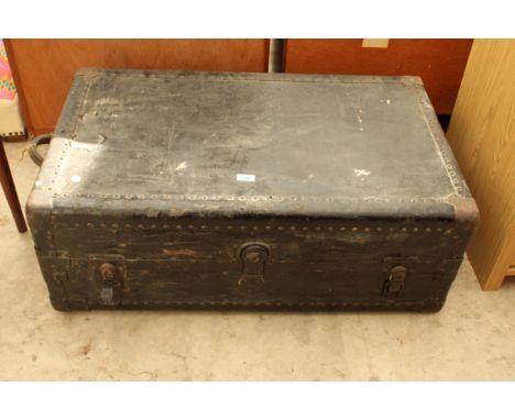 A BLACK PAINTED CUSHION TOP AND STUDDED TRAVELLING  TRUNK 36" X 21" 