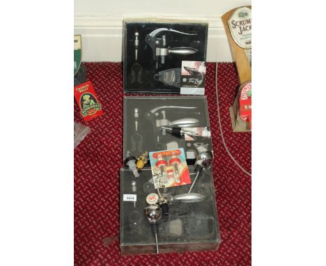 THREE AS NEW AND BOXED CORKSCREW SETS AND BOTTLE POURERS ETC 