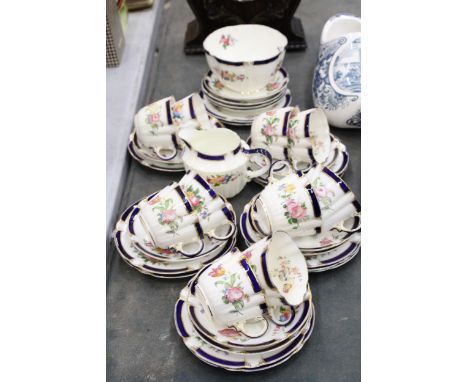 A GEORGE JONES CRESCENT WARE TEA SET TO INCLUDE A CREAM JUG, SUGAR BOWL, CUPS, SAUCERS AND SIDE PLATES 