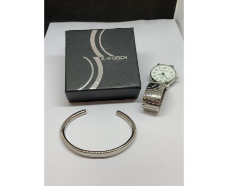 A SUAY DESIGN 'GRAVITY' STEEL BANGLE, TOGETHER WITH A PHILIP MERCIER WATCH 