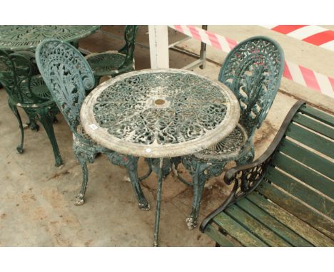 A VINTAGE CAST ALLOY BISTRO SET COMPRISING OF A ROUND TABLE AND TWO CHAIRS 