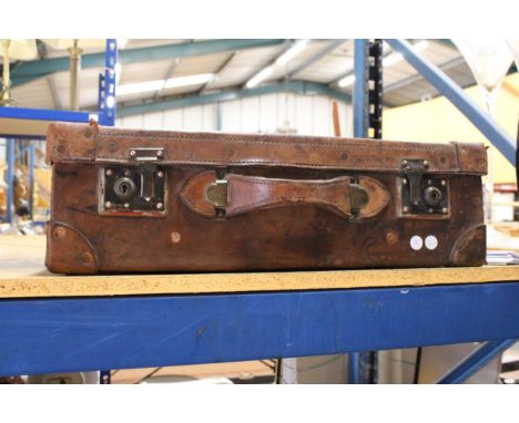 A VINTAGE LEATHER SUITCASE 
