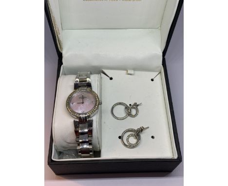 A ROTARY LADIES WRISTWATCH WITH MOTHER OF PEARL FACE AND METAL STRAP, TOGETHER WITH A PAIR OF EARRINGS IN A PRESENTATION BOX 