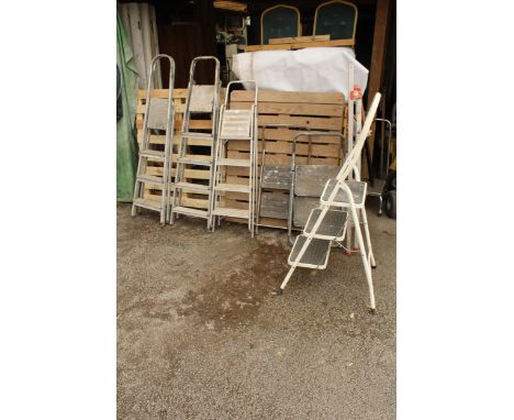 A FOUR RUNG ALUMINIUM STEP LADDER, THREE, THREE RUNG ALUMINIUM STEP LADDERS AND THREE NON SLIP STEP LADDERS 