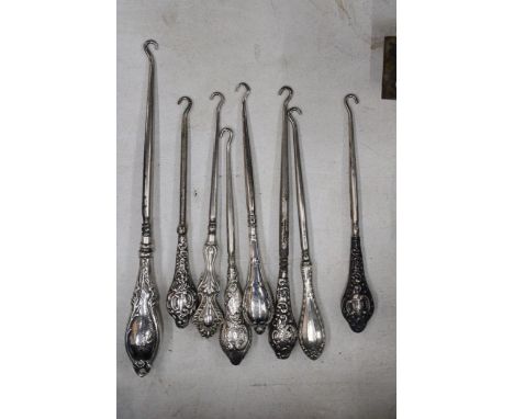 A COLLECTION OF 8 SILVER HALLMARKED BUTTON HOOKS 