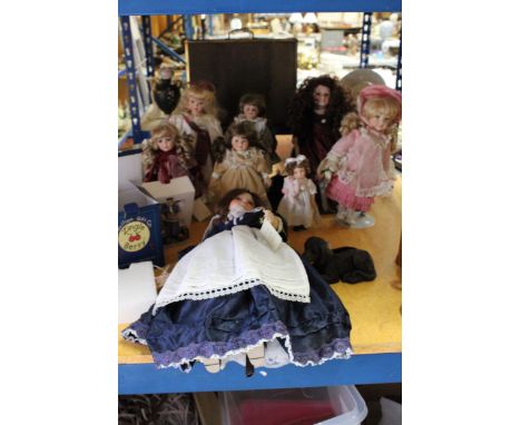 A LARGE QUANTITY OF DOLLS TOGETHER WITH A BOXED PAVILION GIFTS CO. ORNAMENT, A ROYAL WORCESTER CUP AND SAUCER WITH CANDLE, TW