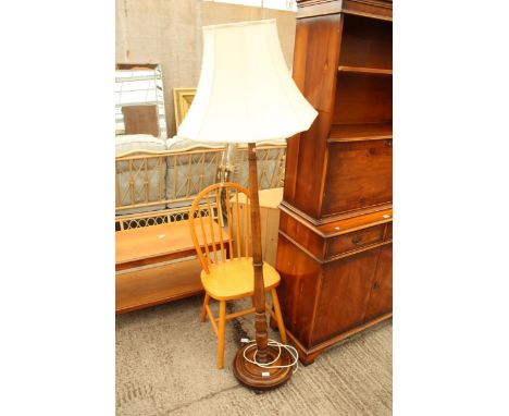 A STANDARD LAMP ON TURNED COLUMN WITH SHADE AND A PINE KITCHEN CHAIR 