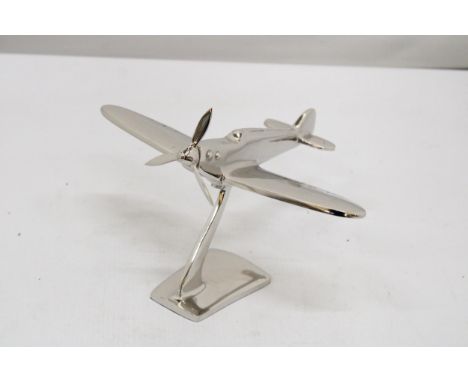 A CHROME MODEL OF A SPITFIRE ON A BASE, HEIGHT 13CM, LENGTH 19CM 