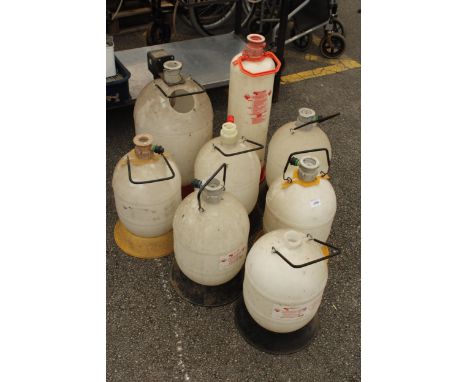 EIGHT VARIOUS BEER PIPE LINE WASHING BOTTLES 