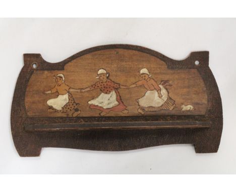 A FOLK ART WOODEN PIPE RACK 