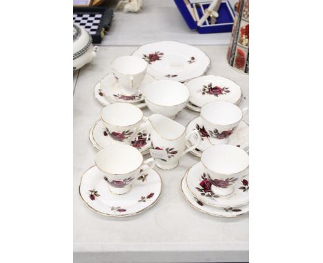 A BONE CHINA TEA SET TO INCLUDE A CREAM AND SUGAR, TEACUPS, PLATES ETC 