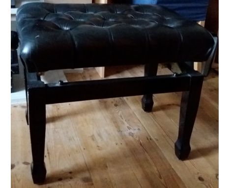 Piano StoolAn adjustable stool in an ebonised finish with a button leather seat; together with another adjustable stool in an