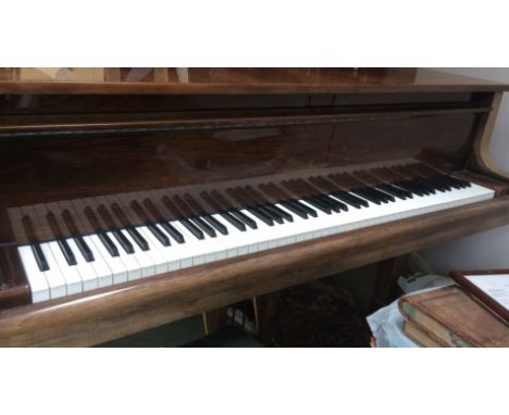 Blüthner (c1986)A 6ft 2in grand piano in a bright mahogany case on square tapered legs; together with a concert adjustable pi