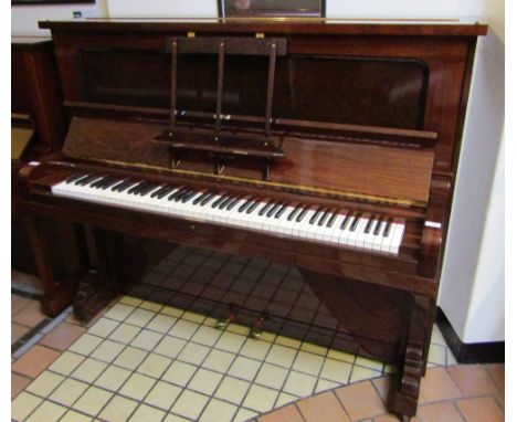 Steinway (c1905)A Model K upright piano in a rosewood case.  This piano has been recently re-built.