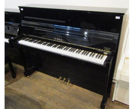 Hoffmann (c2001) A Model T120 upright piano in a bright ebonised case.