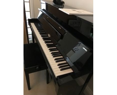 Kemble (c2015)A Model B3SG2 upright piano in a bright ebonised case with silent system; together with an adjustable stool.  A