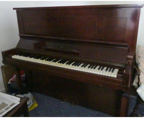 Steinway (c1921)A Model K upright piano in a mahogany case; together with a stool. 