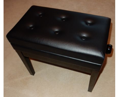 Piano StoolAn adjustable piano stool in a bright ebonised finish with storage under a button leather top.