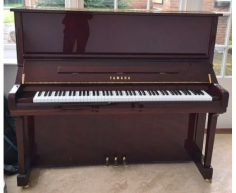 Yamaha (c2004)A Model U3SN upright piano in a bright mahogany case; together with a stool. 
