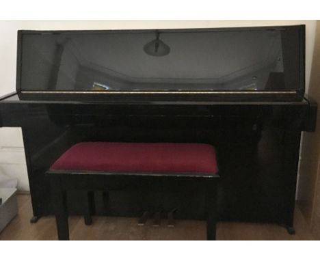 Yamaha (c1987) A Model E108 upright piano in a bright ebonised case; together with an ebonised stool with red velvet top.