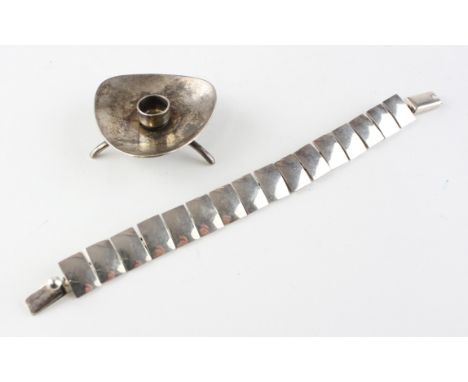 A Danish silver bracelet, stamped 925; together with a footed candlestick, the bracelet of articulated form