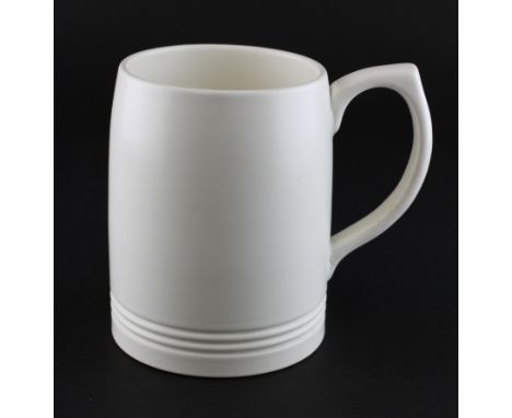 A Wedgwood Keith Murray cream-glazed mug, circa 1950, printed blue KM and Wedgwood marks, impressed K,of tapering cylindirica