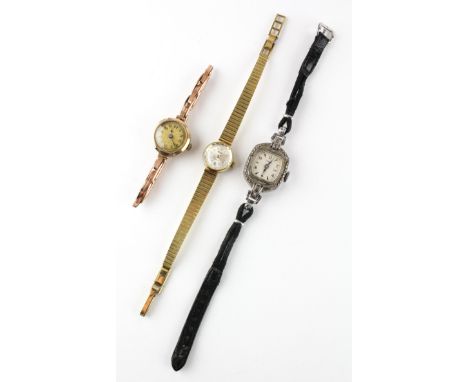 A collection of three wristwatch to include a hallmarked 9ct gold mechanical watch together with a marcasite set timex and a 