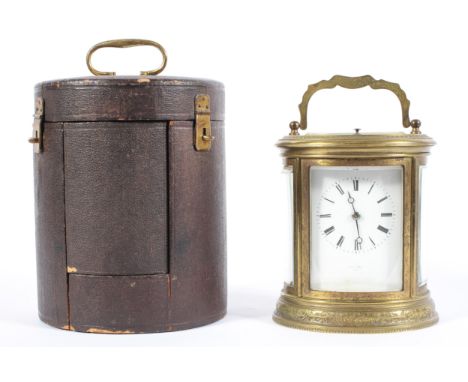 A French brass oval travelling carriage clock and case, mid/late19th century, the white enamelled dial named for Henry Marc/P