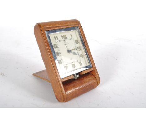 A Jaeger-le-Coultre travel clock, the art deco style rectangular dial with arabic numerals, on an eight day movement, 10.5cm 