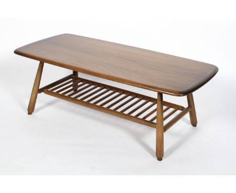 An Ercol coffee table, model no 459, in dark colourway, on splayed legs with lower slated shelf, 99 cm wide x 46 cm deep