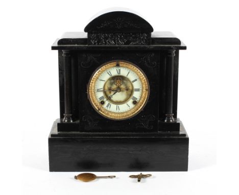 A Victorian black slate mantel clock, the ivorine dial with a central exposed escapement, with key and pendulum, 34cm high, 3
