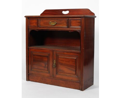 A Victorian mahogany hall cupboard, late 19th century, with pierced gallery, above panelled front with one frieze drawer abov