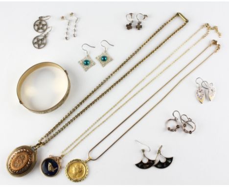 A collection of costume jewellery to include; A rolled gold bangle, Three pendant and chains, Seven pairs of drop earrings. G