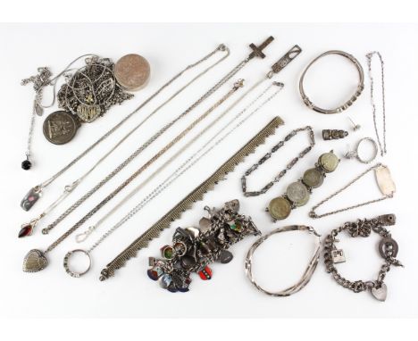 A large collection of jewellery to include: A peridot set bangle, Ten pendants with chains, Two charm bracelets, Two chains, 